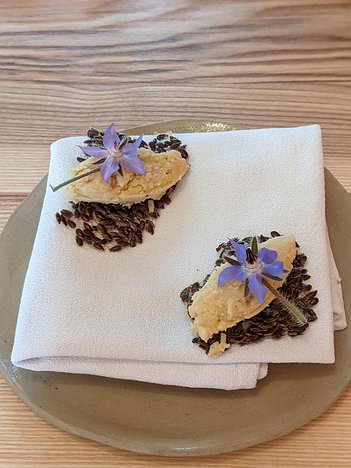 20200917_PXL103705140.PORTRAIT_02.ORIGINAL_Pixel3a-JEB amuse bouche 1 : linseed biscuit with chickpea hummus and borage flower and ...