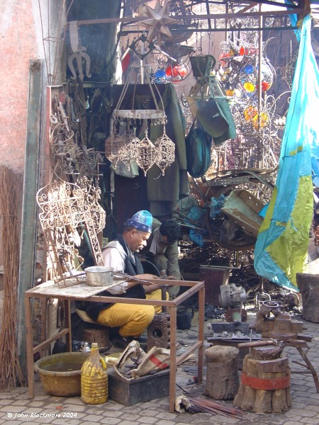 Marrakech066.jpg - metal worker in the depths of the Marrakech souk